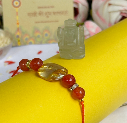 Rakhi to Boost Strength and Confidence with Red Onyx Shell & Green Aventurine Ganesha - Abhimantrit